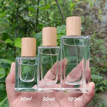 Парфюмна бутилка 30ml50ml100ml кристално бял материал стъкло дебело дъно байонетна висококачествена спрей дървен капак парфюмна бутилка