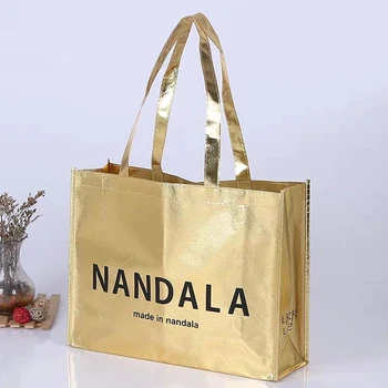 Търговия на едро 500pcs/Lot Персонализирано лого Метални платнени торбички за пазаруване Златни ламинирани пазарски чанти за промоция Многократна употреба Нетъкан печатен